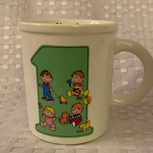 Now I am One, vintage child’s ceramic mug, by Enesco, in 1982, 3 inches tall.